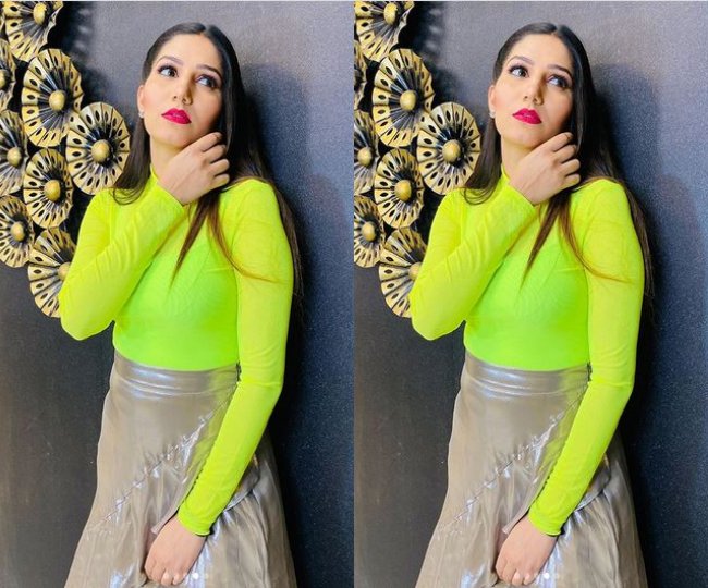 Sapna Chaudhary Flaunting In Fluorescent Top And Metallic Skirt