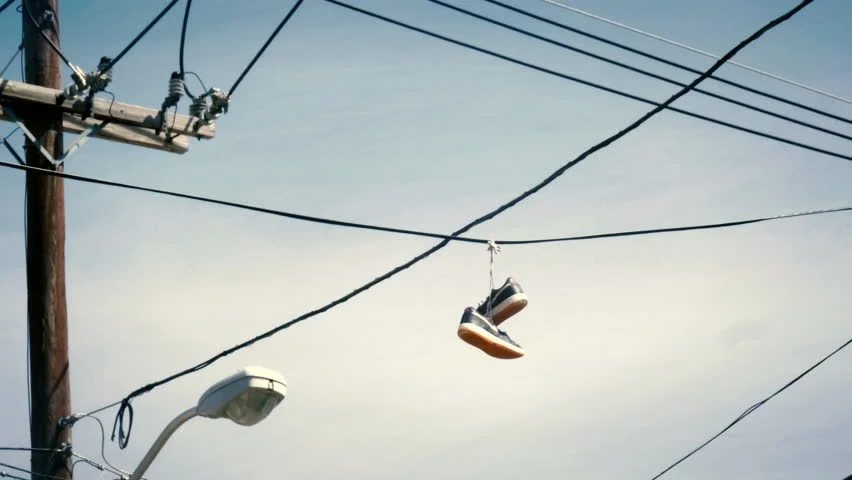 shoes hanging on wire