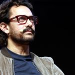 Aamir Khan smiling in a casual outfit.