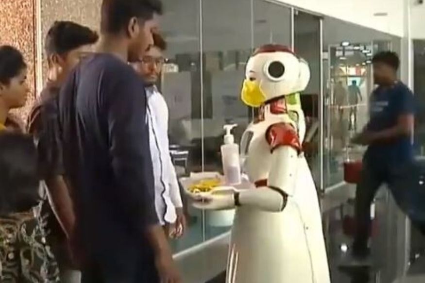 Robots distributing sanitizers in kerala